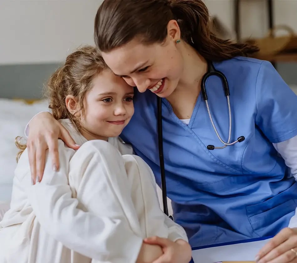 Female doctor with little girl
